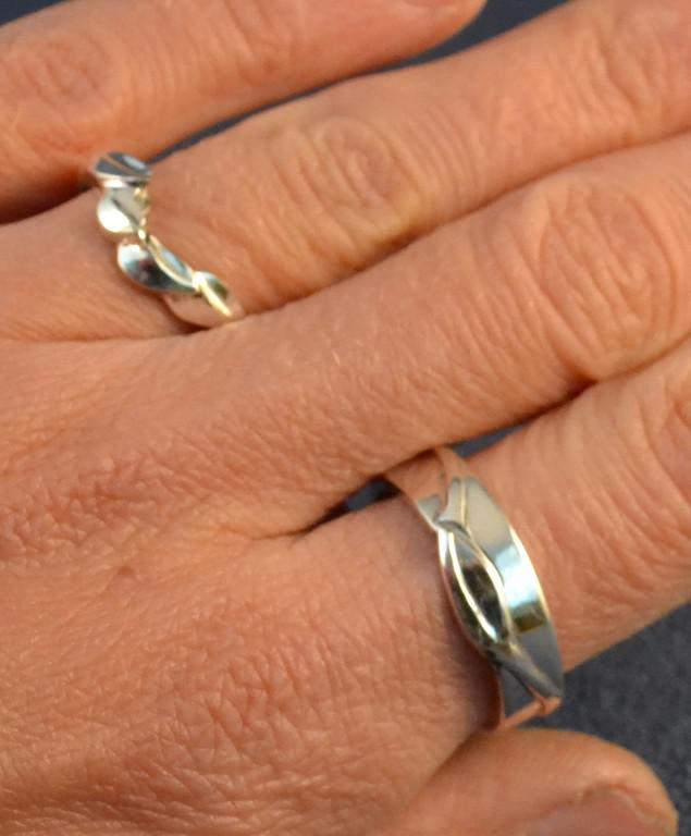 Wedding Bands, the one with 4 leaves interlocks with the Sterling silver and Sapphire ring